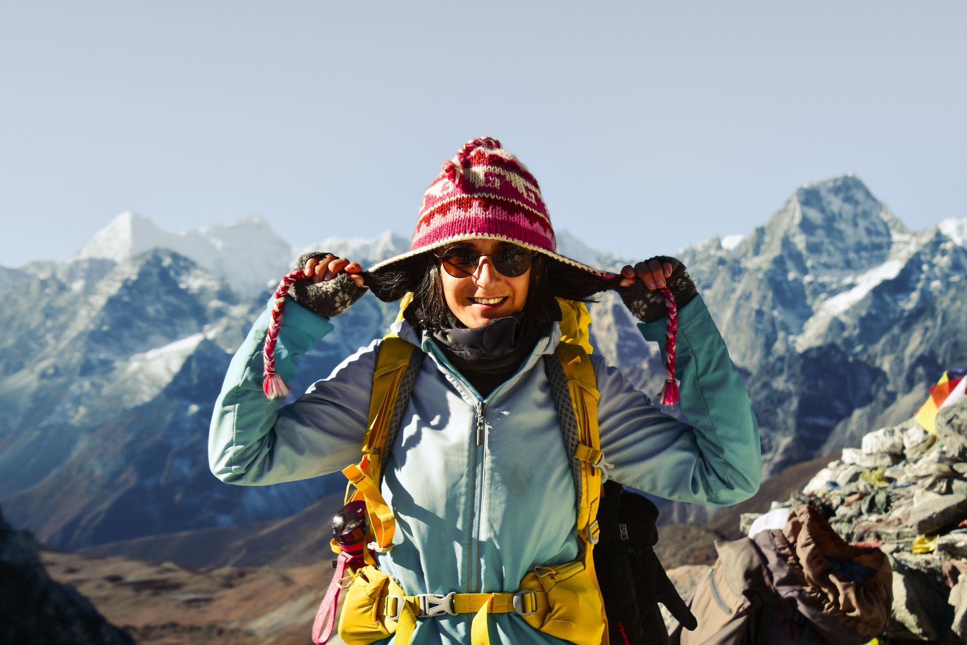 Woman carefree trekker enjoy View of peak range from Cho La pass in Everest region, Nepal. EBC trekking detour to Gokyo Ri